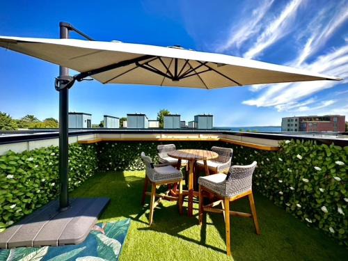 Traverse City House | 2BR Suncatcher Downtown Rooftop Steps to Beach