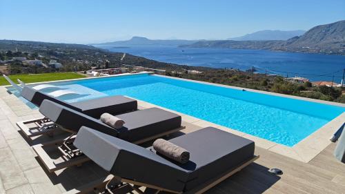 Pitharion Villa | Bay Overlook Villa heated pool