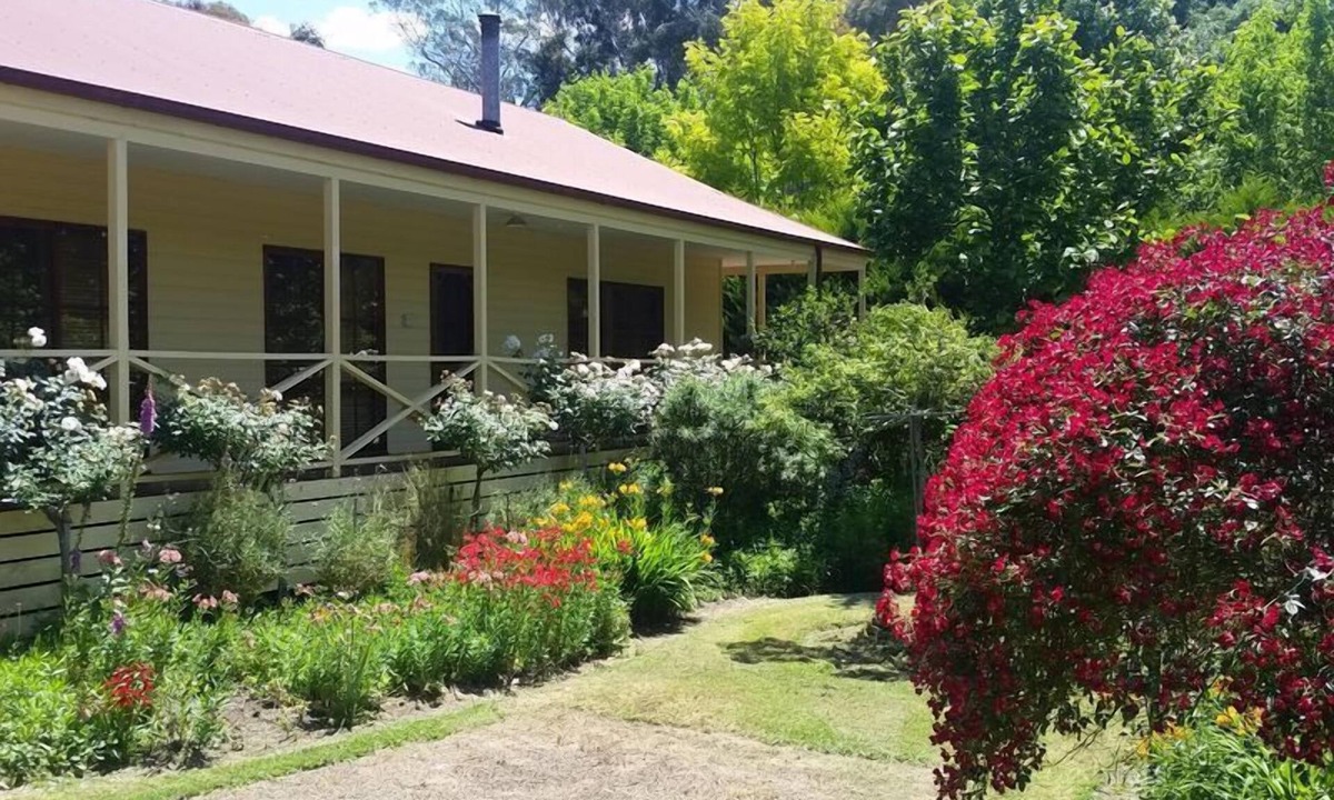 Buxton House | Buxton Gardens by the River Country style home, river flowing thru the backyard