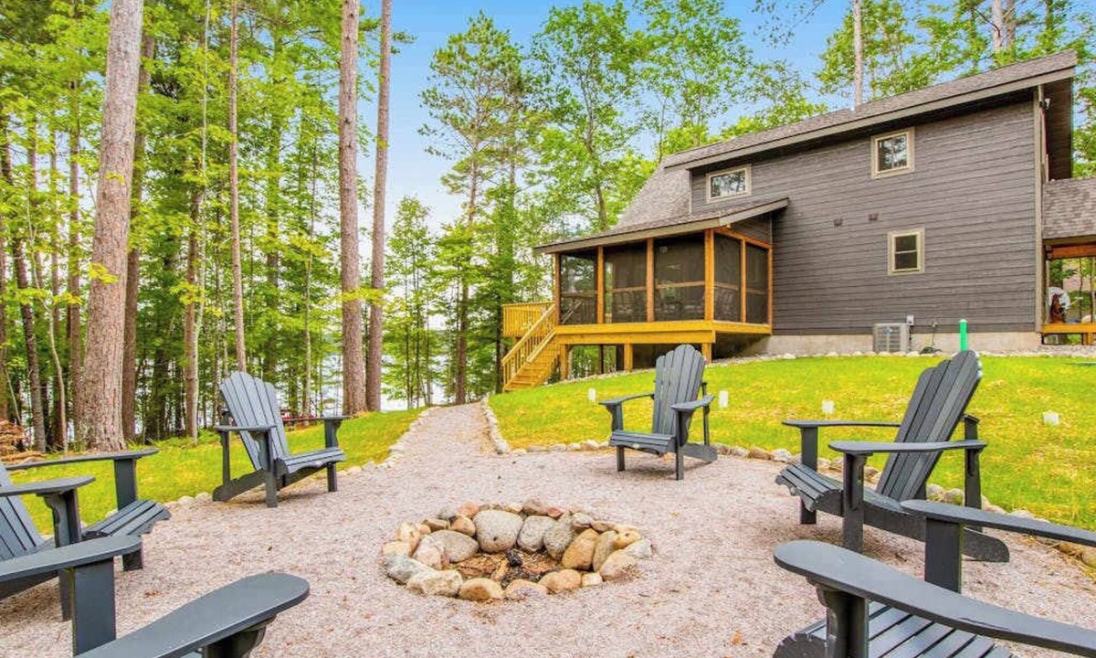 Eagle River House | Gorgeous lake home with private pier, beach, firepit, deck, & grill + water toys