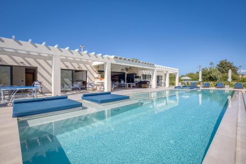 Almiros Beach Villa | Villa Serenissima - Beachfront Villa with Indoor & Outdoor Pools and Gym by Posarelli Villas