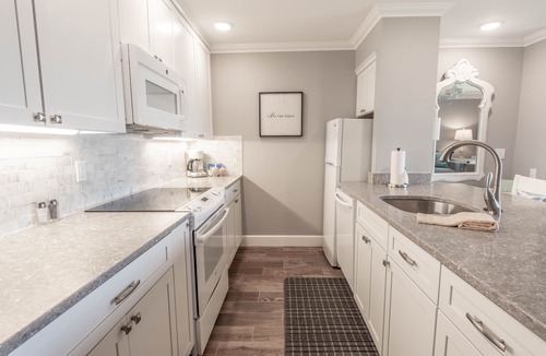 Boyne City Condo | 112 Water Street | Lake Charlevoix Views | Private Patio and Beach |
