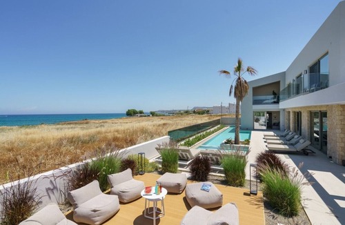 Sfakaki Villa | Beachfront Villa with Eco heated Pool, Hot Tub, Playroom and walk to restaurants