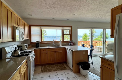 Traverse City House | Beautiful spot on Lake Leelanau, 4-bedrooms, includes dock and kayaks.