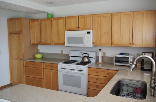 Traverse City House | Beautiful spot on Lake Leelanau, 4-bedrooms, includes dock and kayaks.