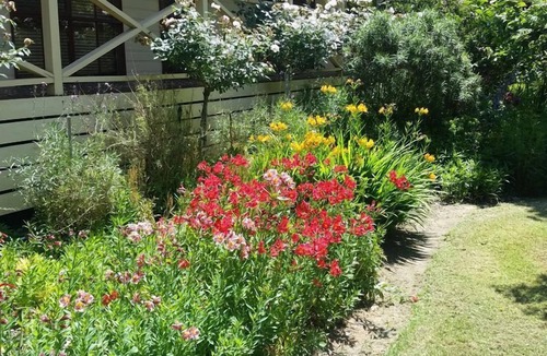 Buxton House | Buxton Gardens by the River Country style home, river flowing thru the backyard