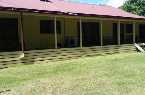 Buxton House | Buxton Gardens by the River Country style home, river flowing thru the backyard