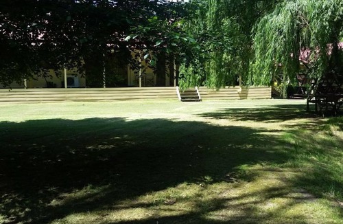 Buxton House | Buxton Gardens by the River Country style home, river flowing thru the backyard
