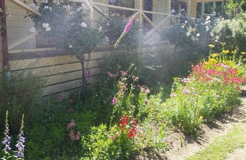 Buxton House | Buxton Gardens by the River Country style home, river flowing thru the backyard