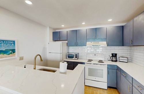 Maple City Condo | Condo in Glen Arbor with Lake Michigan sunset views, fireplace, deck, washer & dryer