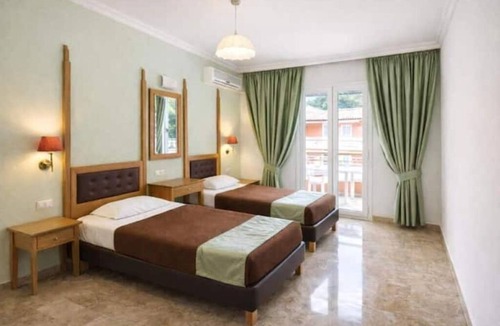 Achilleio Hotel | Cozy Coastal Hideaway at Irene Apartments – Steps from Agios Gordios Beach