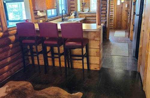 Gaylord Cabin | Cozy log cabin on quiet lake. Games, kayaks, and more for all-season fun.