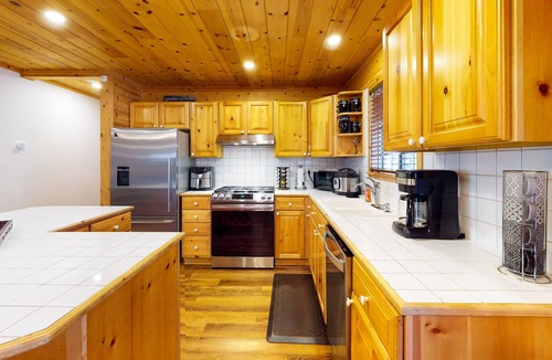 South Lake Tahoe Cabin | Dog-friendly log cabin near Heavenly with yard, private hot tub, & game room