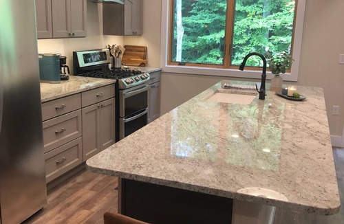 Traverse City Condo | Forest & Brook View Condo – Tranquil Porch, Minutes to TC Breweries & Cafés!