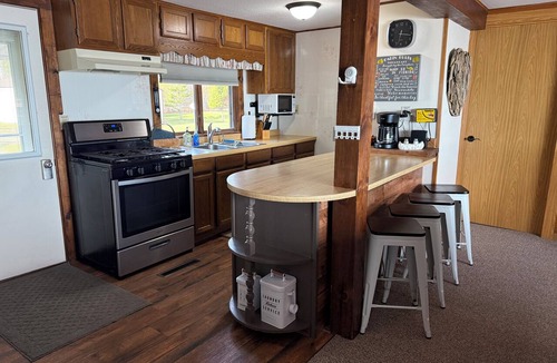 Manistique Cottage | Lake Life Landing Indian Lake Waterfront w/Private Dock