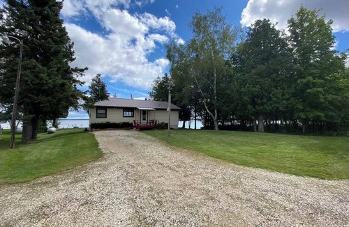 Manistique Cottage | Lake Life Landing Indian Lake Waterfront w/Private Dock