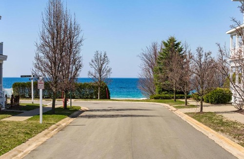 Bay Harbor House | Lake-view 5BR Blue Harbor retreat with pool, beach access, and resort amenities.
