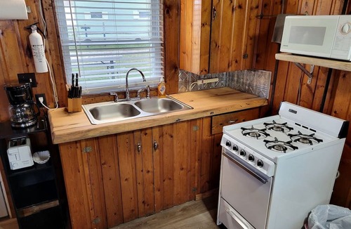 Houghton Lake Cabin | Lakefront Cottage with Fire Pit, Beach & Pet Friendly in Houghton Lake, Michigan