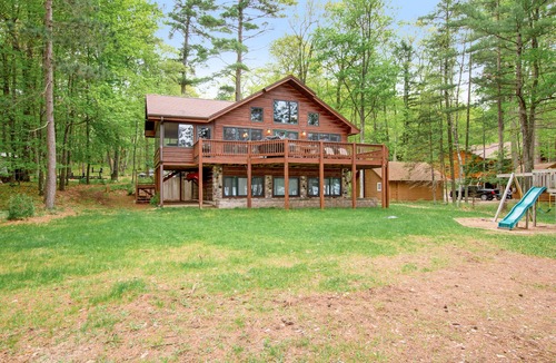 Conover House | Lakefront dog-friendly home with firepit, play set, dock, & beach access