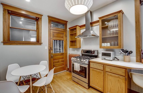 North Center Apartment | Light Filled with Tasteful Pops of Color - You Will Love This Mid-Century Modern Gem by AllSet Turnover