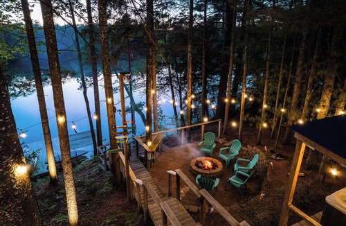 South Boardman House | Peaceful Lakefront Retreat w/Hot Tub, Fire Pit, Game Room, Screened Deck