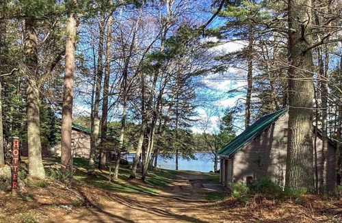 Rhinelander House | Peaceful, quiet lakefront dog-friendly cabin w/fishing dock, boats, campfire pit