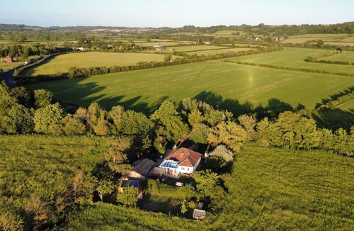 Chippenham Cabin | Private, air-conditioned log cabin, with field views, own garden and shower room