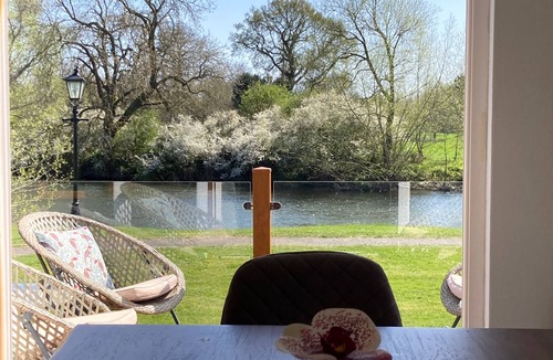 Tiddington House | River Retreat Lodge is front line with panoramic views over the river Avon.