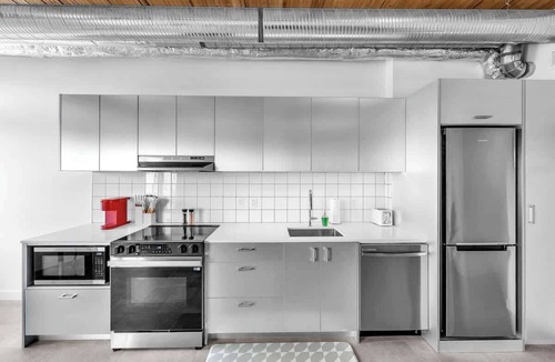 East Village Apartment | Rooftop Oasis w/River Views & Sauna Access