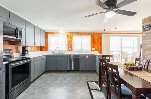 Alpena House | Spacious 4-bedrooms lake front retreat in delightful Alpena area.