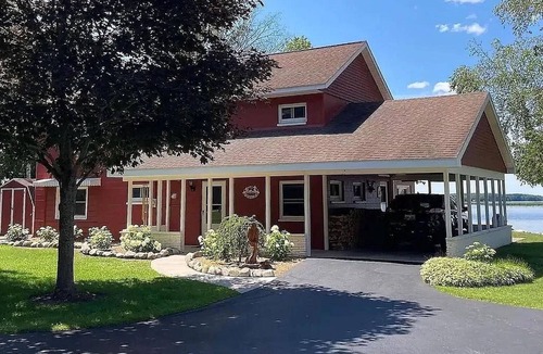 Alpena House | Spacious 4-bedrooms lake front retreat in delightful Alpena area.