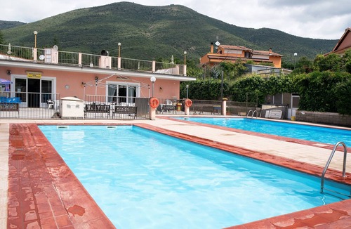 Piamboschi Apartment | Studio Apartment "Monolocale Con Soppalco 43" with Shared Pool, Private Terrace & Wi-Fi
