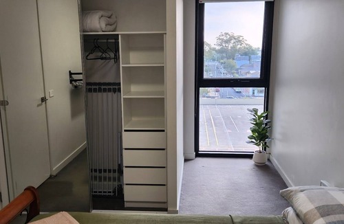 Cheltenham Apartment | Stylish two-bedroom stay near Southland, beach, cafés, dining, and trains.