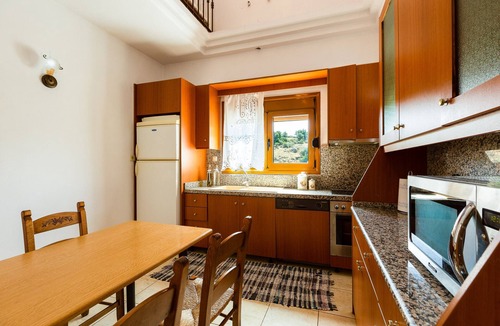 Panormos Villa | Villa Eleutheria, a cozy and private retreat with an outdoor Pool and Jacuzzi.