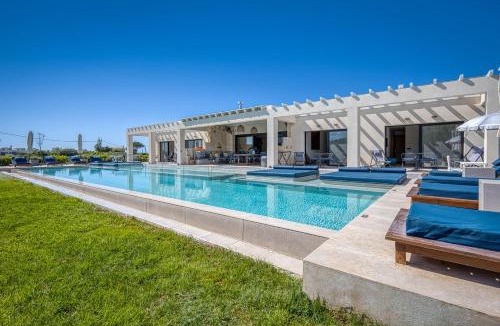 Almiros Beach Villa | Villa Serenissima - Beachfront Villa with Indoor & Outdoor Pools and Gym by Posarelli Villas