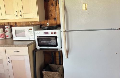 Tawas City Cottage | Welcoming Lake Huron Cowboy Cottage with AC, kayaks, & more in Tawas