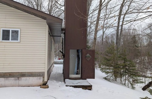 Skanee House | Welcoming off Grid 2-bedroom Cabin in Skanee. On the Big Huron River Fish camp!