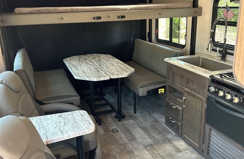 Mira Monte House | Winnebago camper set up on beautiful property with resort style pool and jacuzzi