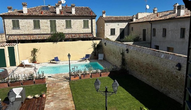 Apartment in a village with swimming pool