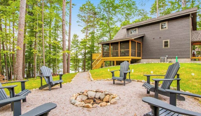 Gorgeous lake home with private pier, beach, firepit, deck, & grill + water toys