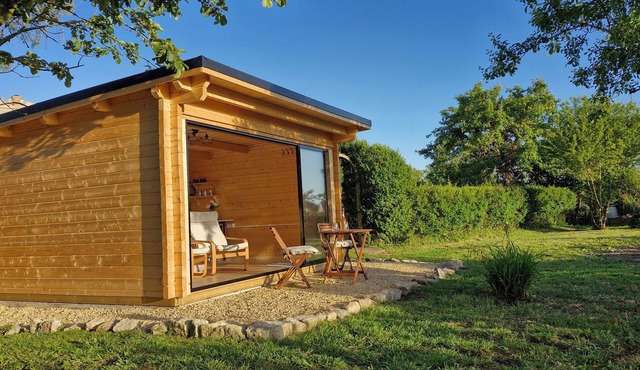 Private, air-conditioned log cabin, with field views, own garden and shower room