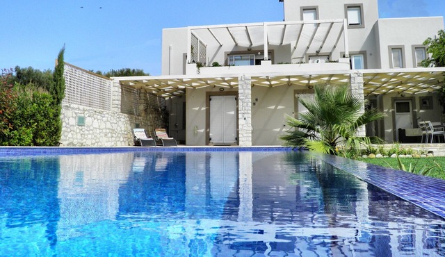 R 193 Spacious 5 bedroom Mansion with Private Bathrooms with Heated Swimming Pool