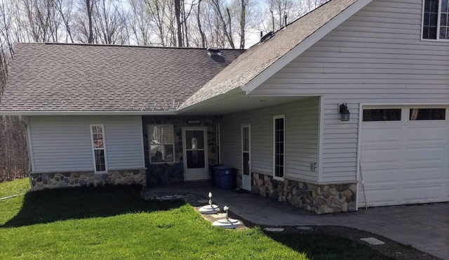 Spacious home with EV charging station two miles from Big Bay Town Park.