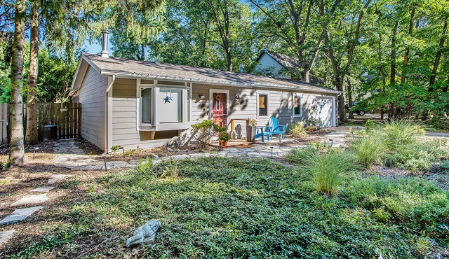 Sweet home in a garden setting with private hot tub, firepit & association beach