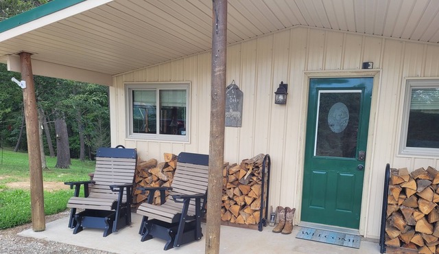 Twin Oaks is a rustic and pet friendly cabin located on 50 mostly wooded acres
